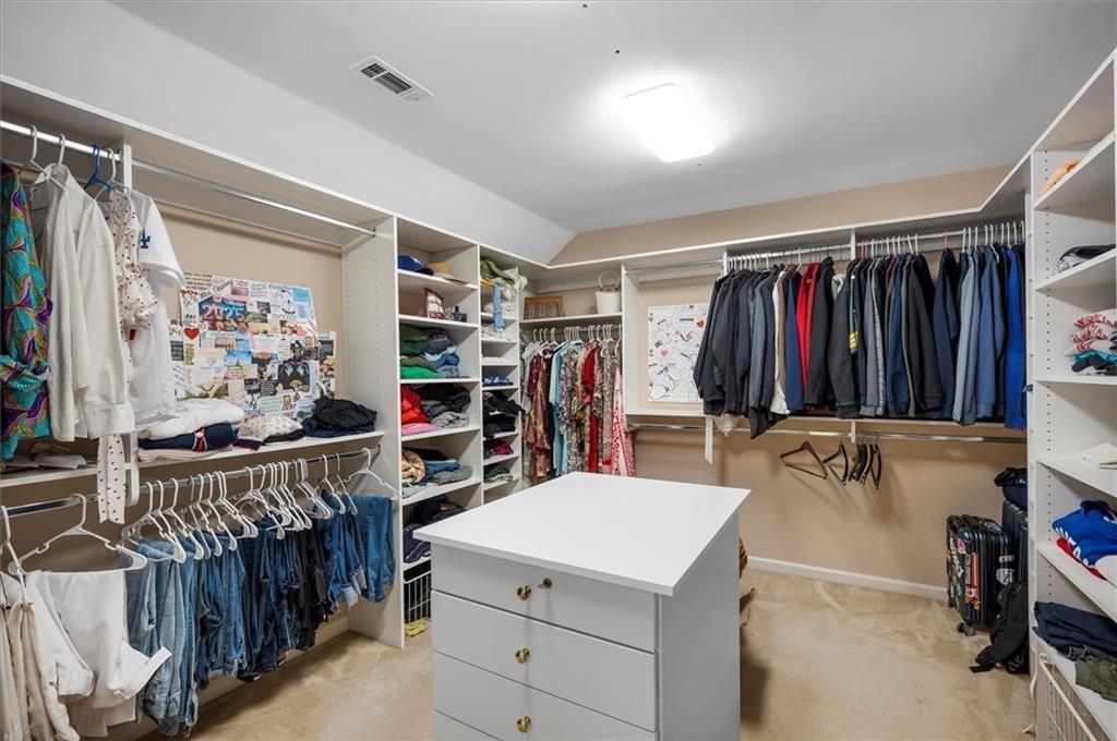 130 Belvedere Court Atlanta, GA 30350 - Photo 43 of 59 a view of walk in closet with clothes and shoes