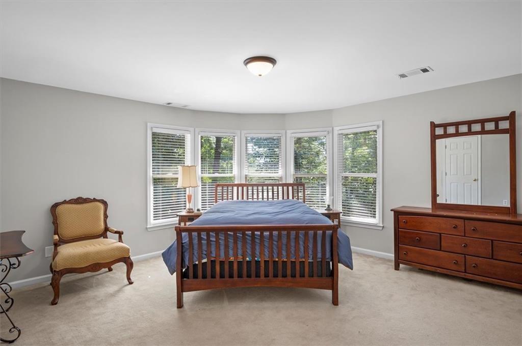 130 Belvedere Court Atlanta, GA 30350 - Photo 44 of 59 a bedroom with furniture and a window
