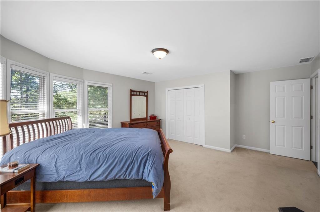 130 Belvedere Court Atlanta, GA 30350 - Photo 45 of 59 a bedroom with a bed and a window
