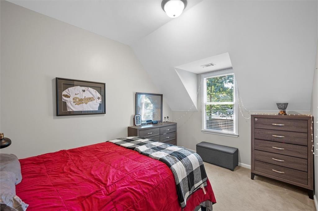 130 Belvedere Court Atlanta, GA 30350 - Photo 47 of 59 a bedroom with a bed and a window