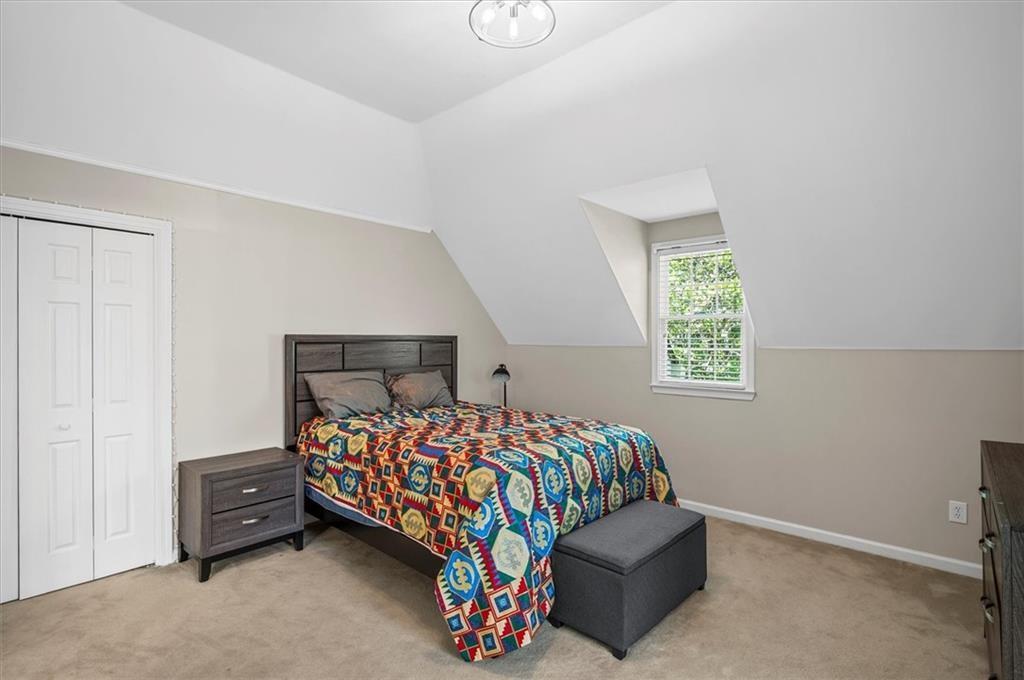 130 Belvedere Court Atlanta, GA 30350 - Photo 50 of 59 a bedroom with a bed and a window