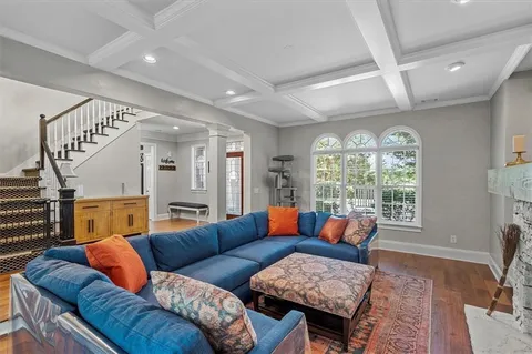 a living room with cabinets and a fireplace
