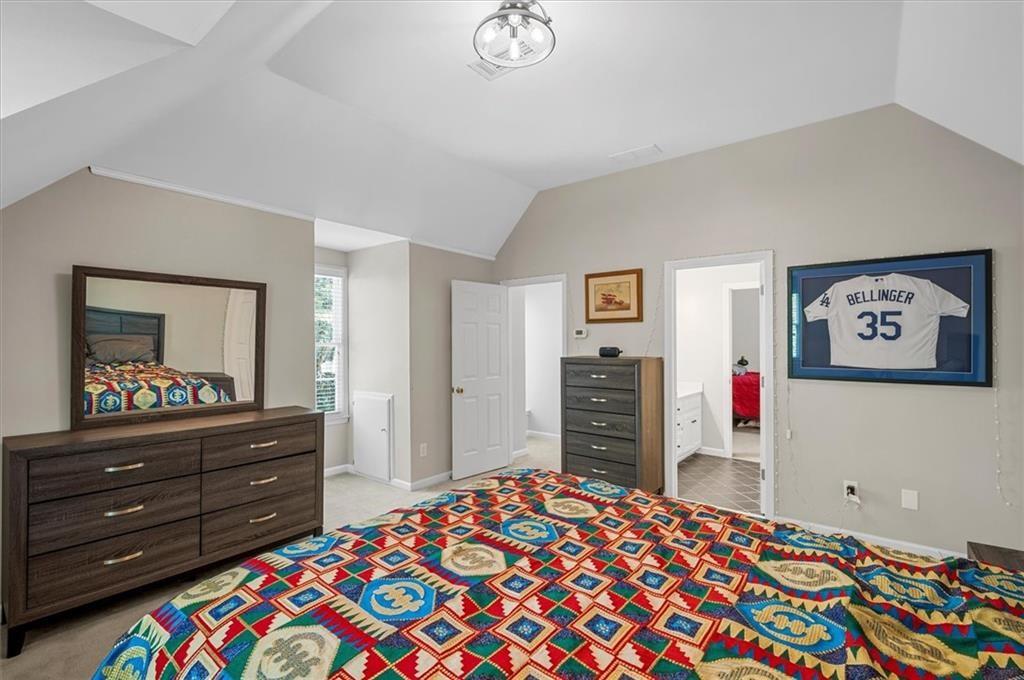 130 Belvedere Court Atlanta, GA 30350 - Photo 51 of 59 a bedroom with a bed and a dresser in it