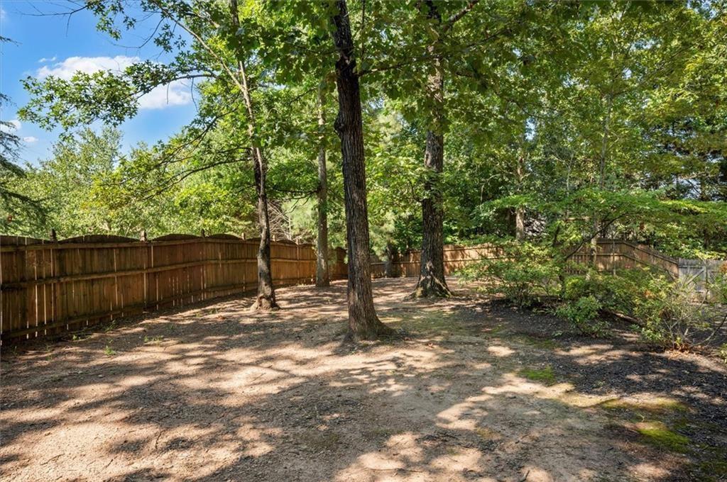 130 Belvedere Court Atlanta, GA 30350 - Photo 55 of 59 a backyard of a house with lots of green space