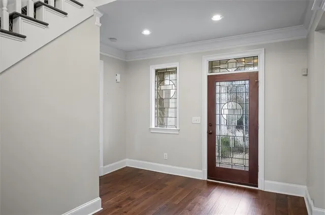 a view of entryway with wooden floor and workspace