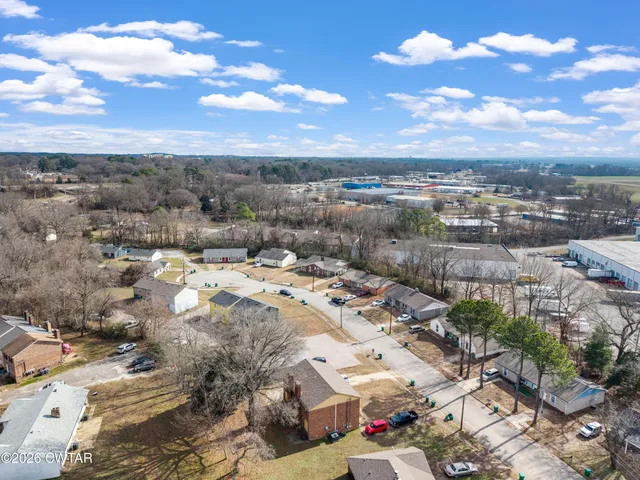 a white refrigerator freezer and a stove sitting inside of a kitchen