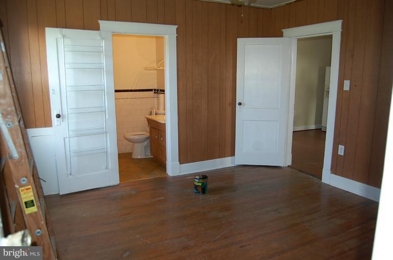 10514 Liberty Road Frederick, MD 21701 - Photo 2 of 17 an empty room with wooden floor and a window