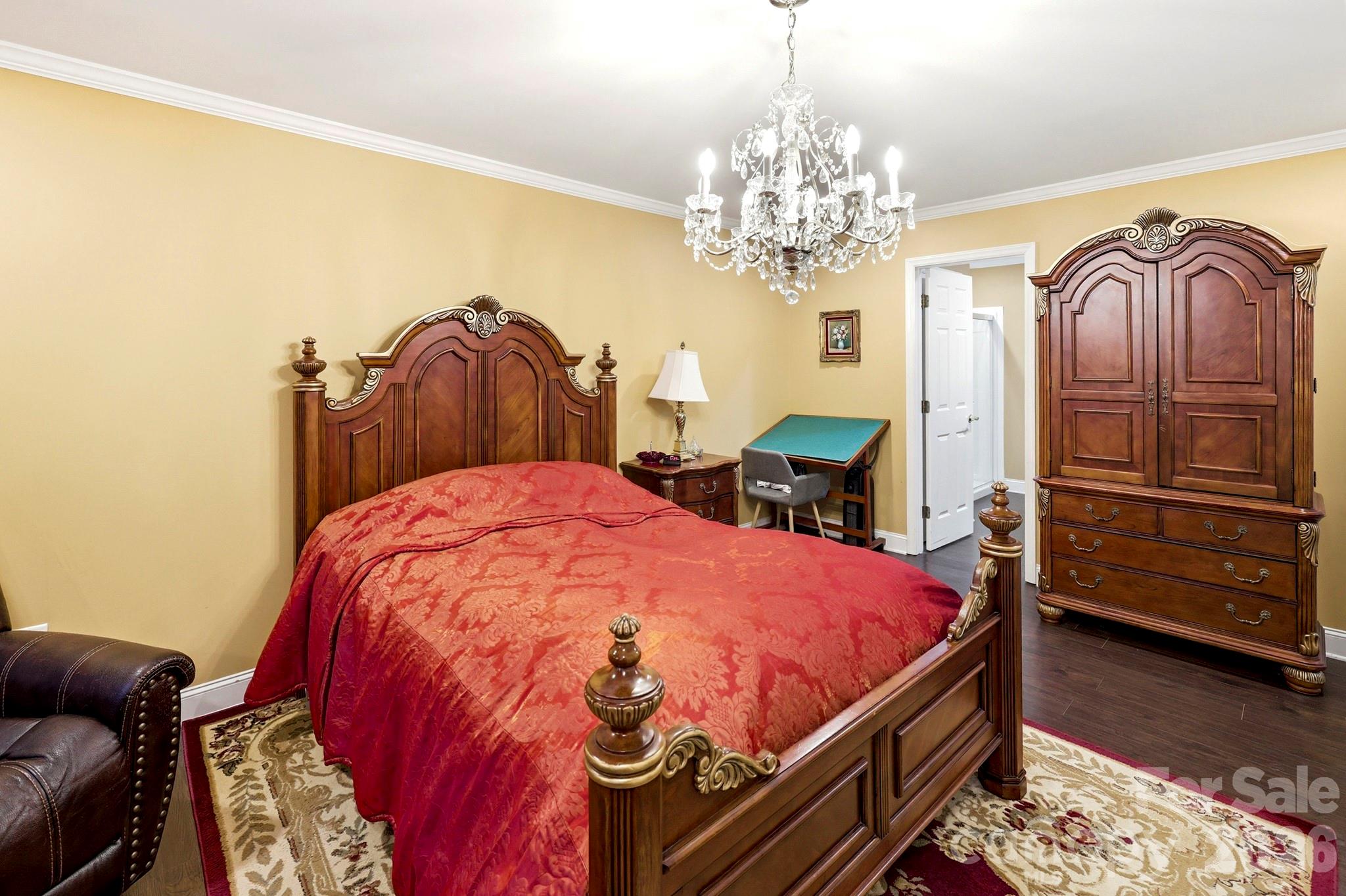 327 Sherry Street Rutherfordton, NC 28139 - Photo 12 of 22 a bedroom with bed and wooden floor