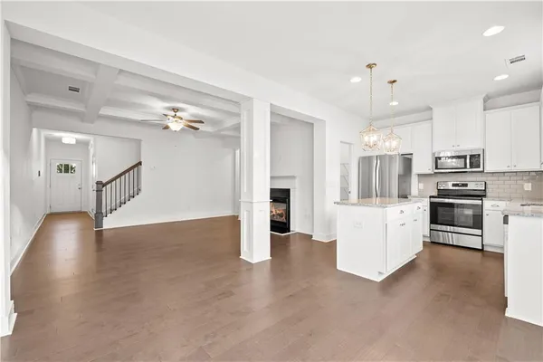 a view of a kitchen with electric appliances