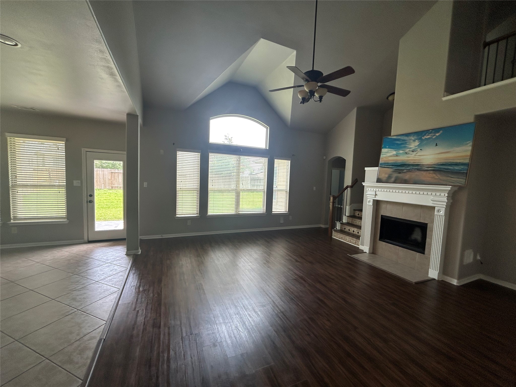 7936 Lake Commons Drive Rosenberg, TX 77469 - Photo 8 of 33 an empty room with windows and fireplace