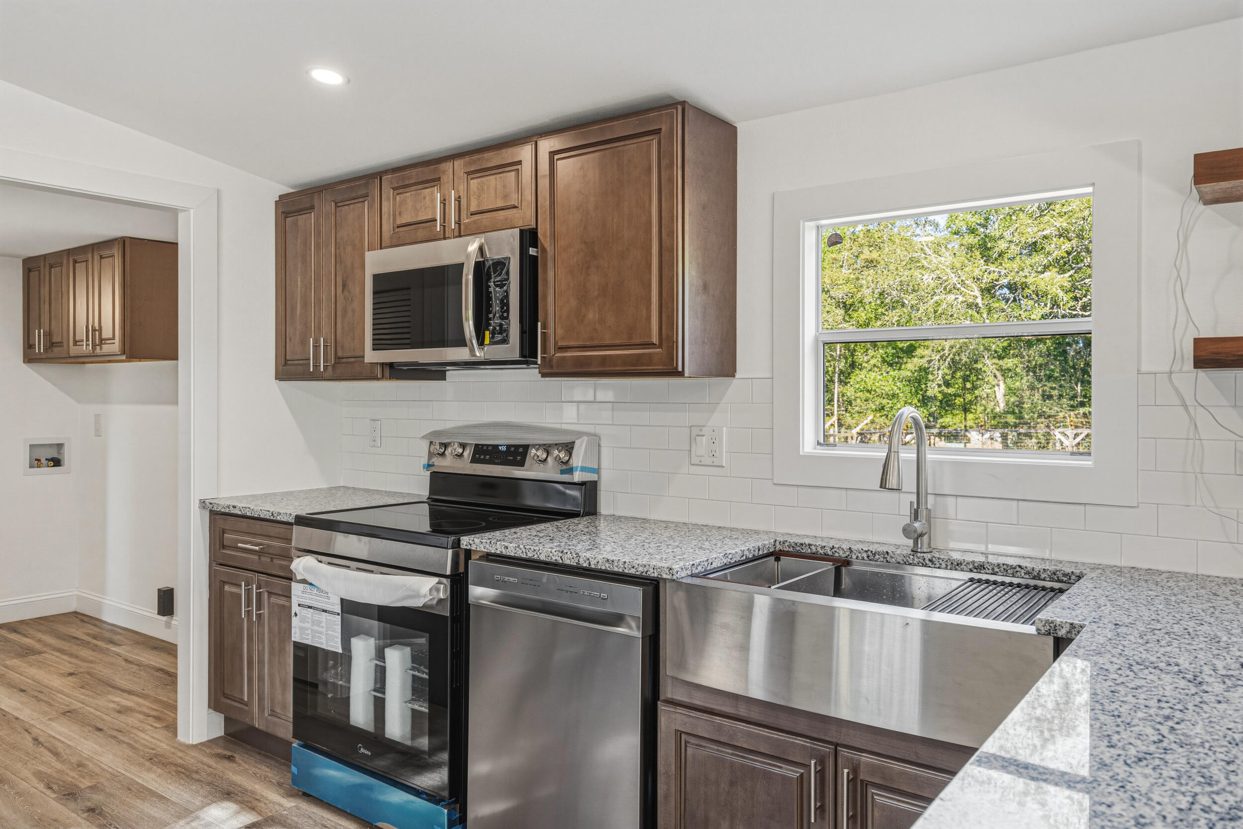 4249 Barlow Road Crestview, FL 32536 - Photo 12 of 40 a kitchen that has a sink and a stove top oven