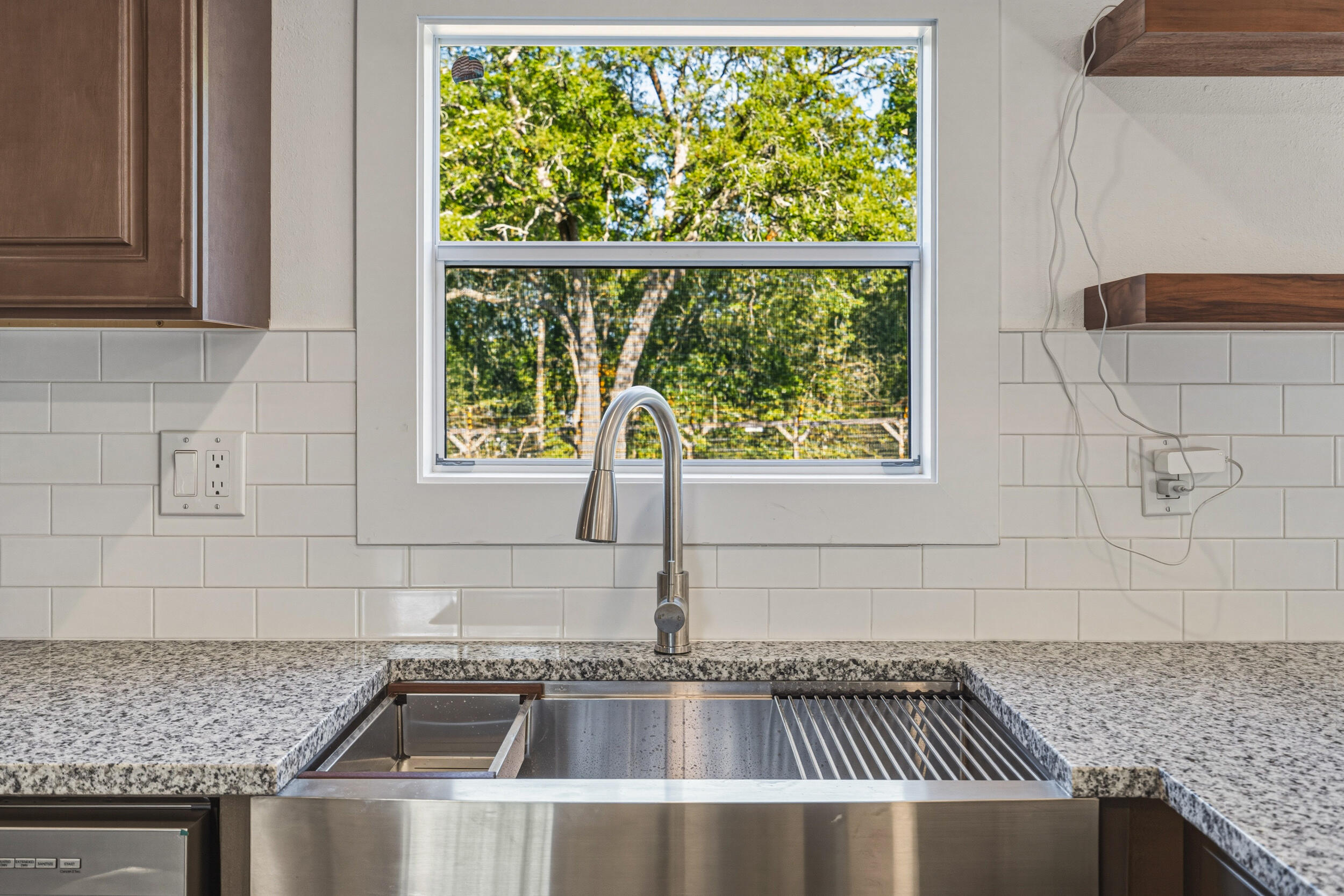 4249 Barlow Road Crestview, FL 32536 - Photo 13 of 40 a kitchen with granite countertop a sink and a window