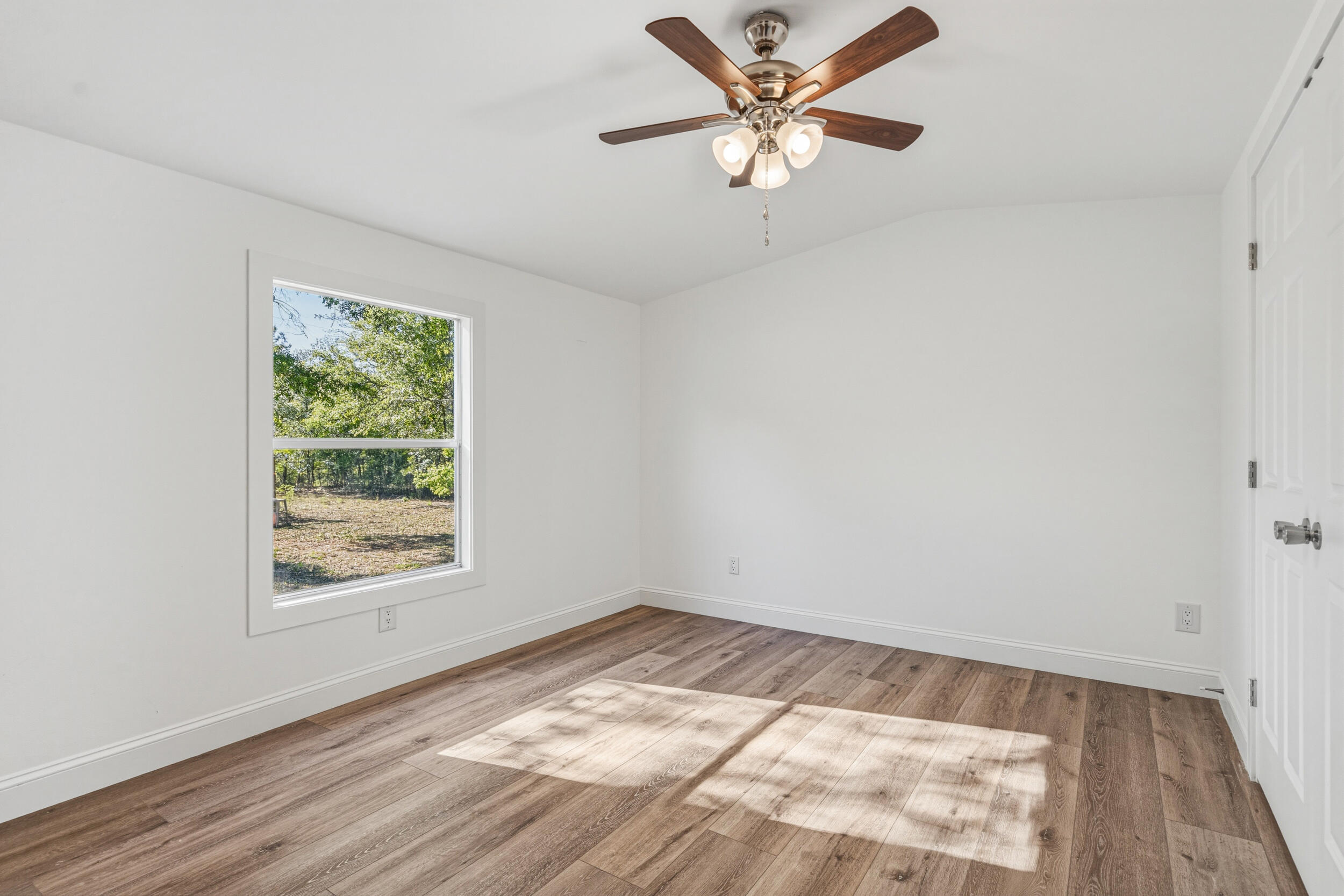 4249 Barlow Road Crestview, FL 32536 - Photo 19 of 40 an empty room with a window and a ceiling fan