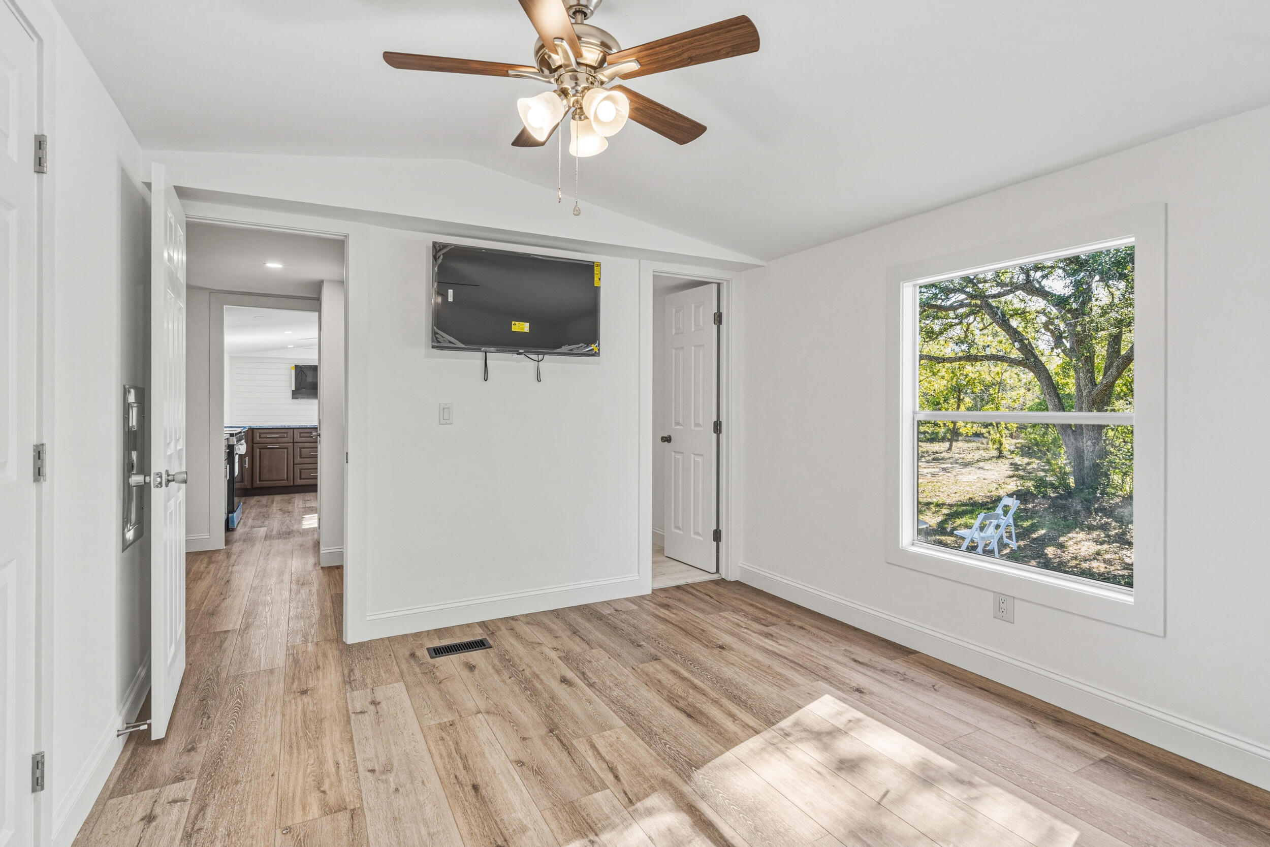 4249 Barlow Road Crestview, FL 32536 - Photo 20 of 40 wooden floor in an empty room with a window