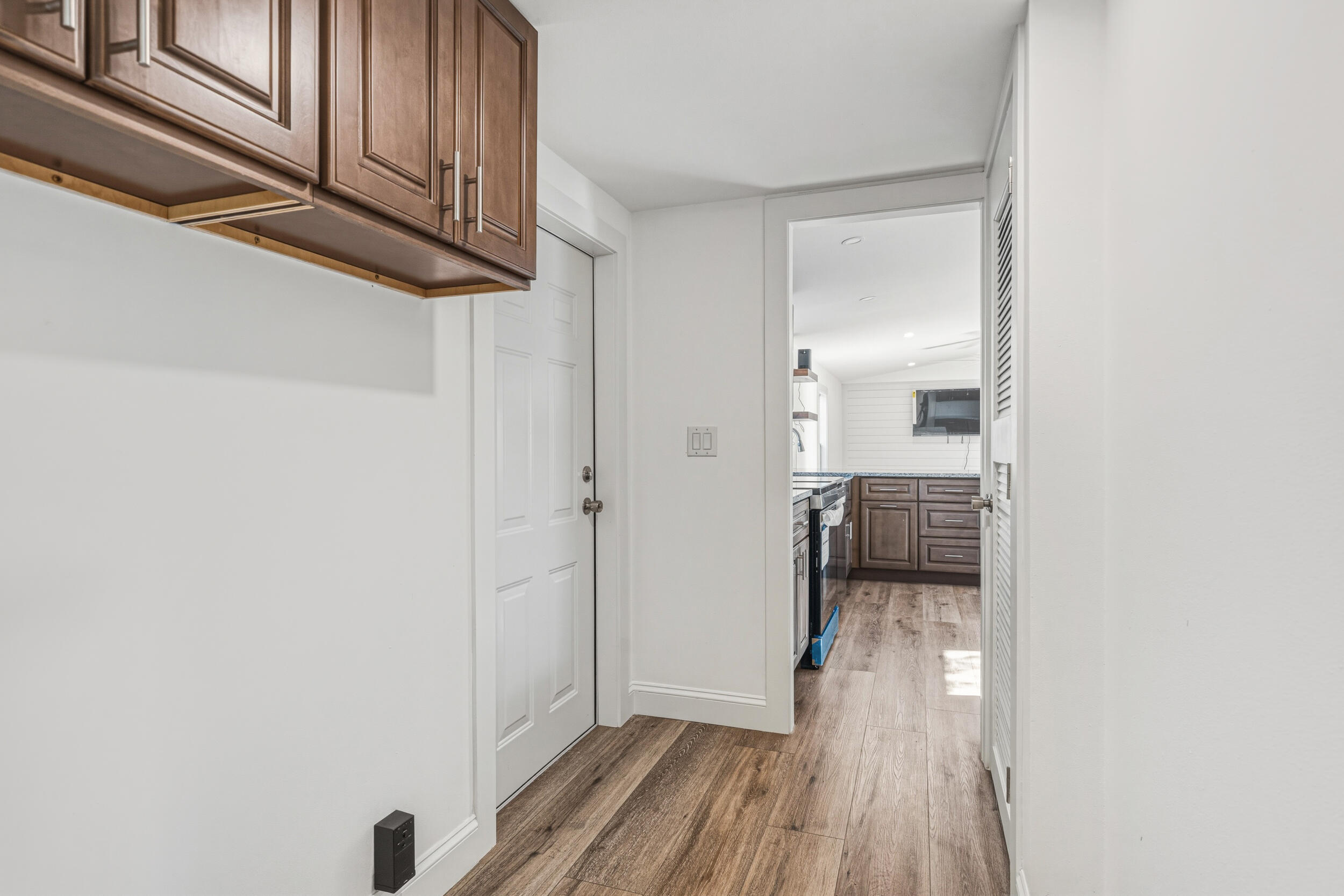 4249 Barlow Road Crestview, FL 32536 - Photo 29 of 40 a view of a hallway with wooden floor