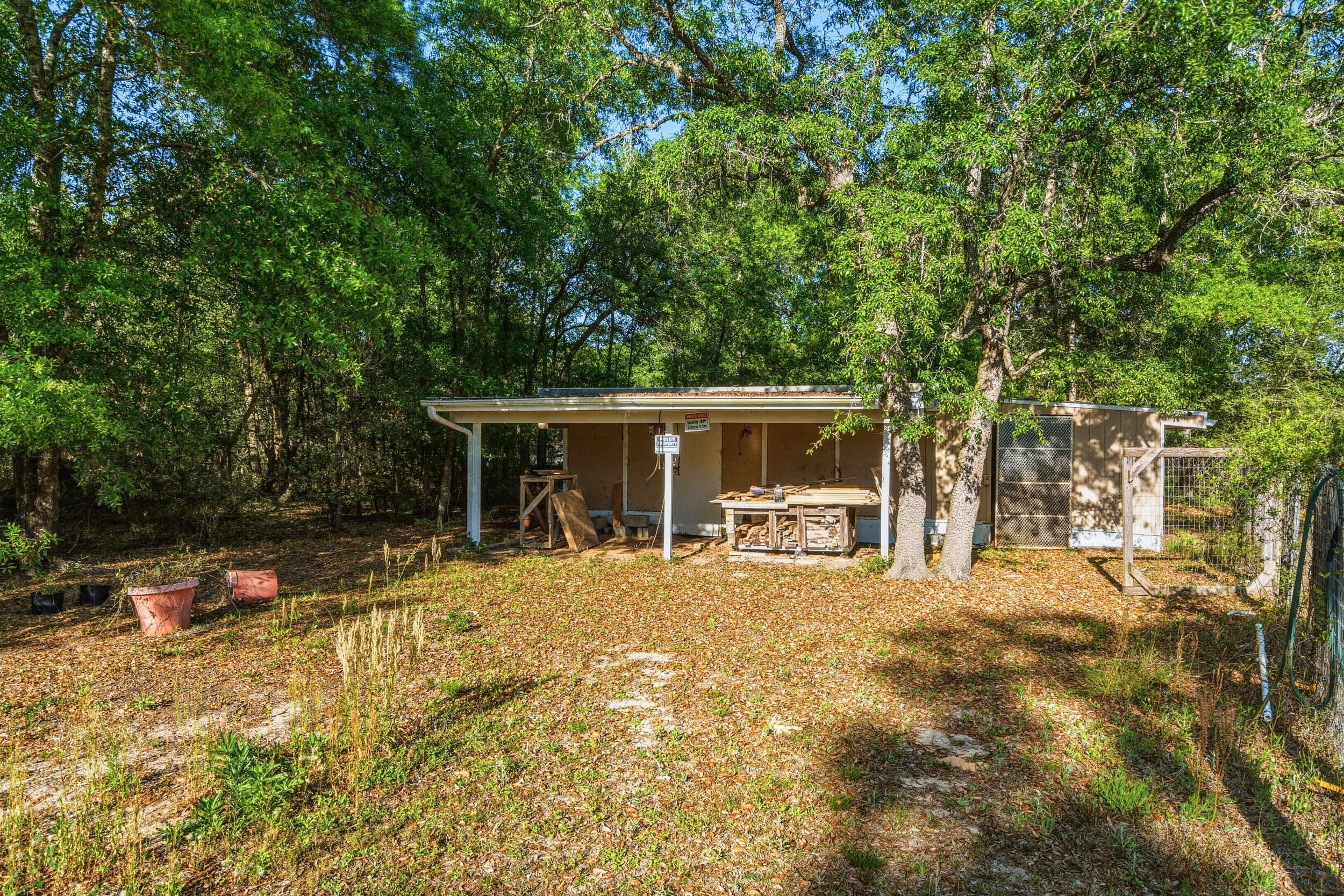 4249 Barlow Road Crestview, FL 32536 - Photo 36 of 40 a view of a house with backyard porch and sitting area