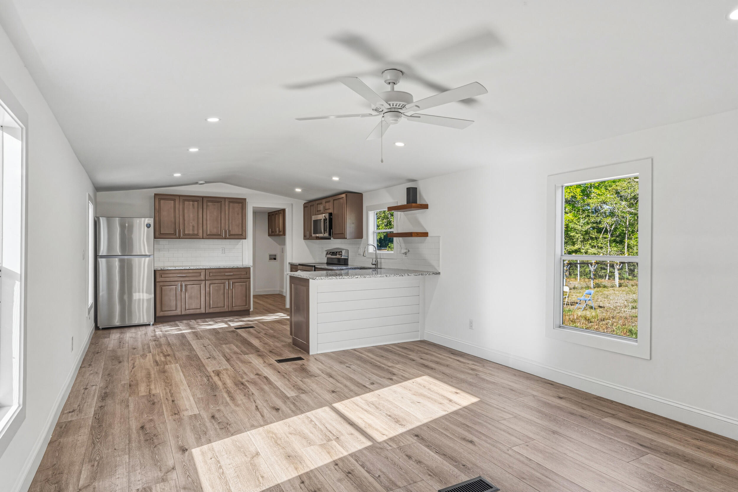 4249 Barlow Road Crestview, FL 32536 - Photo 5 of 40 a view of a kitchen with furniture and wooden floor