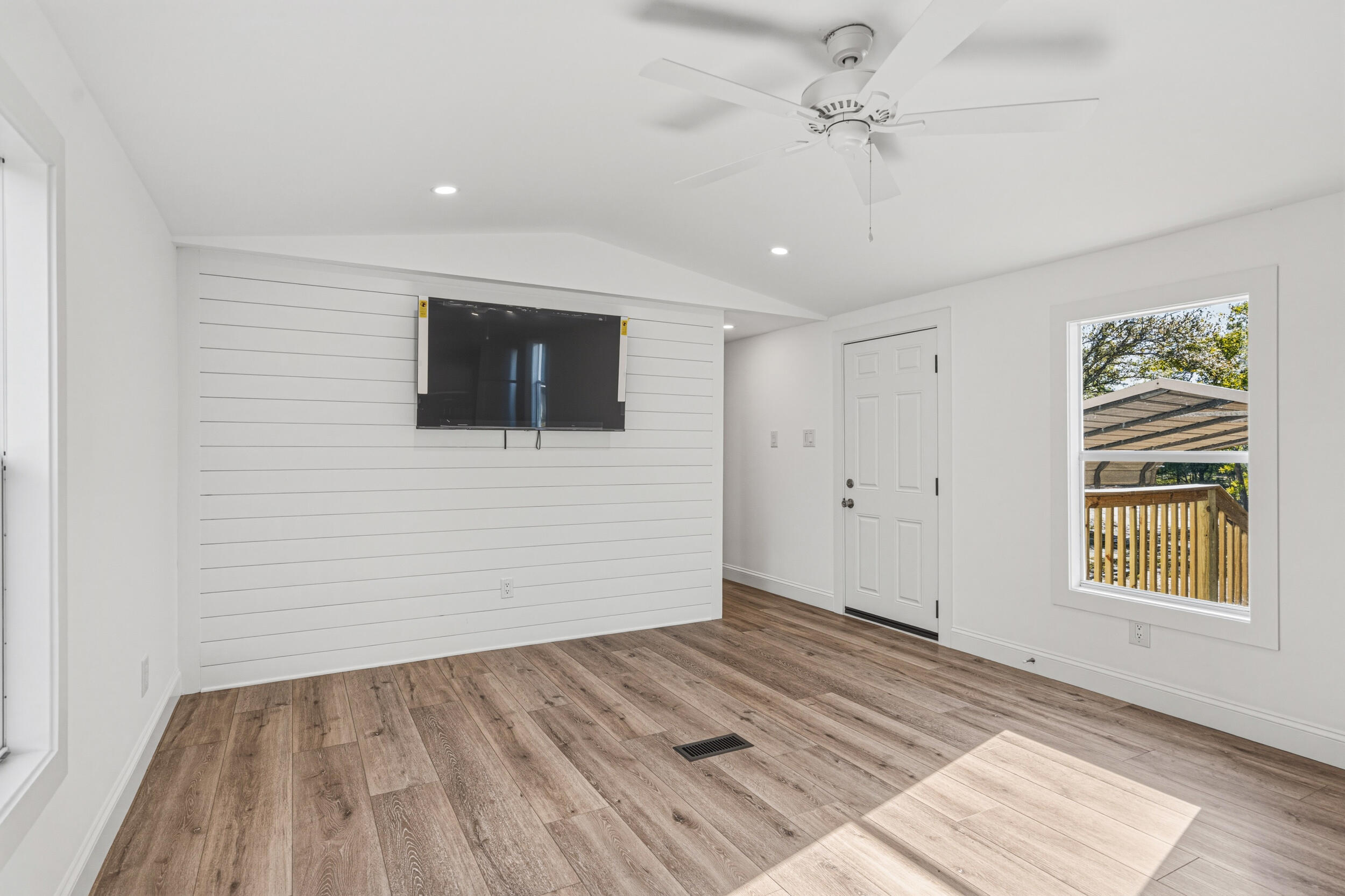 4249 Barlow Road Crestview, FL 32536 - Photo 8 of 40 a view of an empty room with a window and a ceiling fan
