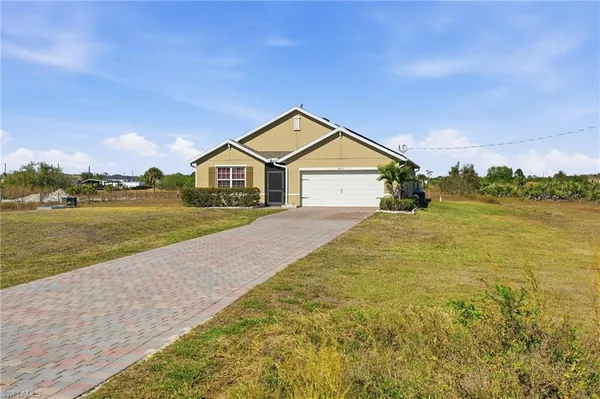 a view of a house with a big yard