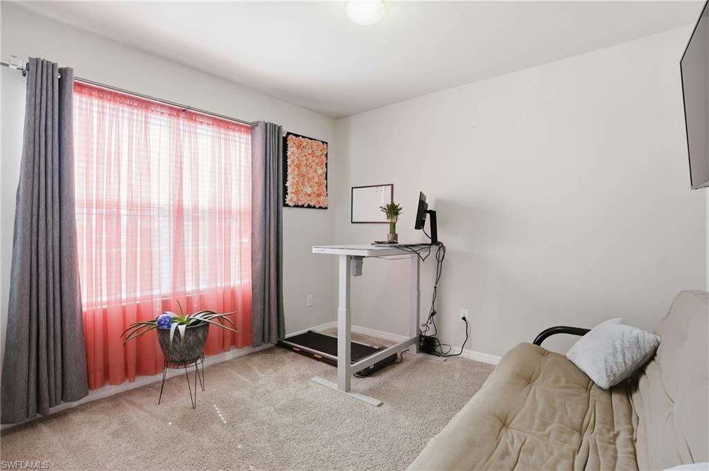 4121 68th Avenue Northeast Naples, FL 34120 - Photo 23 of 33 a room with gym equipment and a window