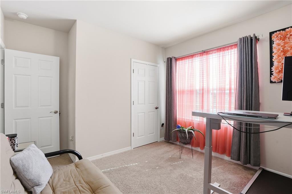 4121 68th Avenue Northeast Naples, FL 34120 - Photo 24 of 33 a bed room with furniture and a window