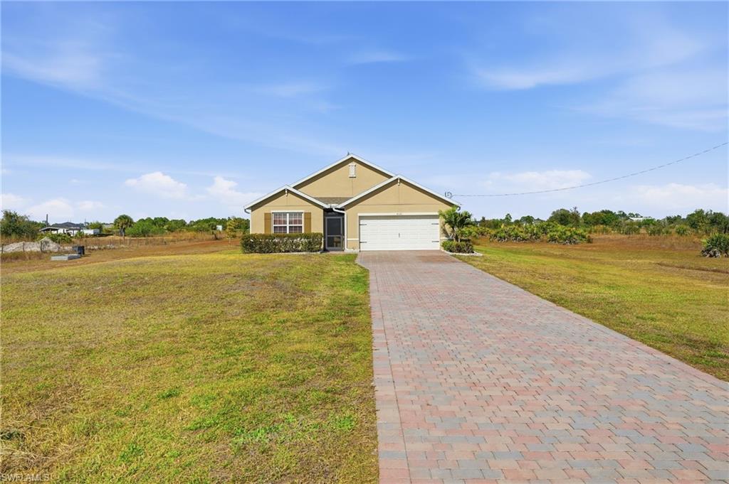 4121 68th Avenue Northeast Naples, FL 34120 - Photo 31 of 33 a view of a lake with a house in the background