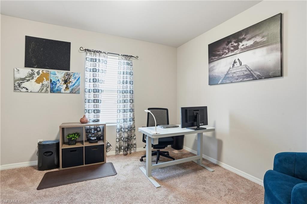4121 68th Avenue Northeast Naples, FL 34120 - Photo 6 of 33 a view of a workspace with furniture and a window