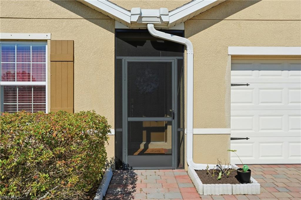4121 68th Avenue Northeast Naples, FL 34120 - Photo 10 of 33 a view of front door of house