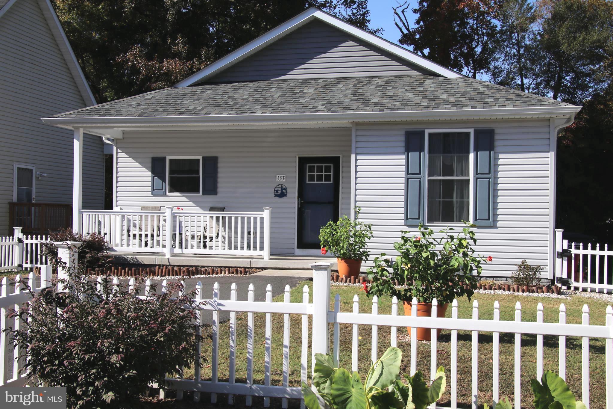 a front view of a house with a porch