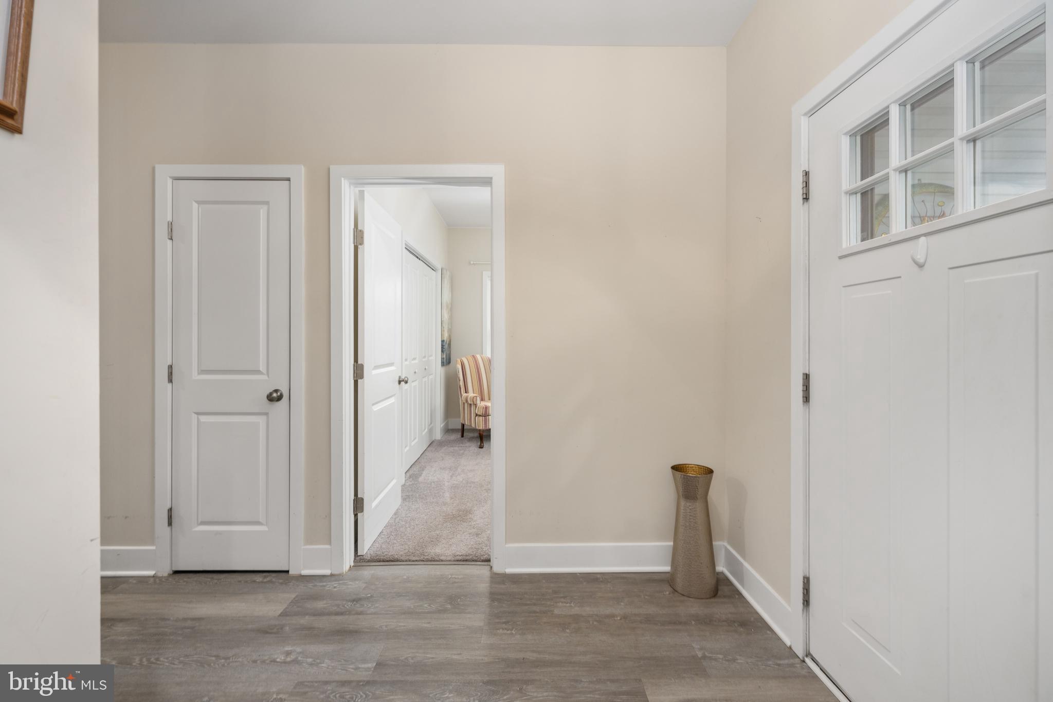 137 12th Street Colonial Beach, VA 22443 - Photo 20 of 66 a view of a hallway with wooden floor and closet