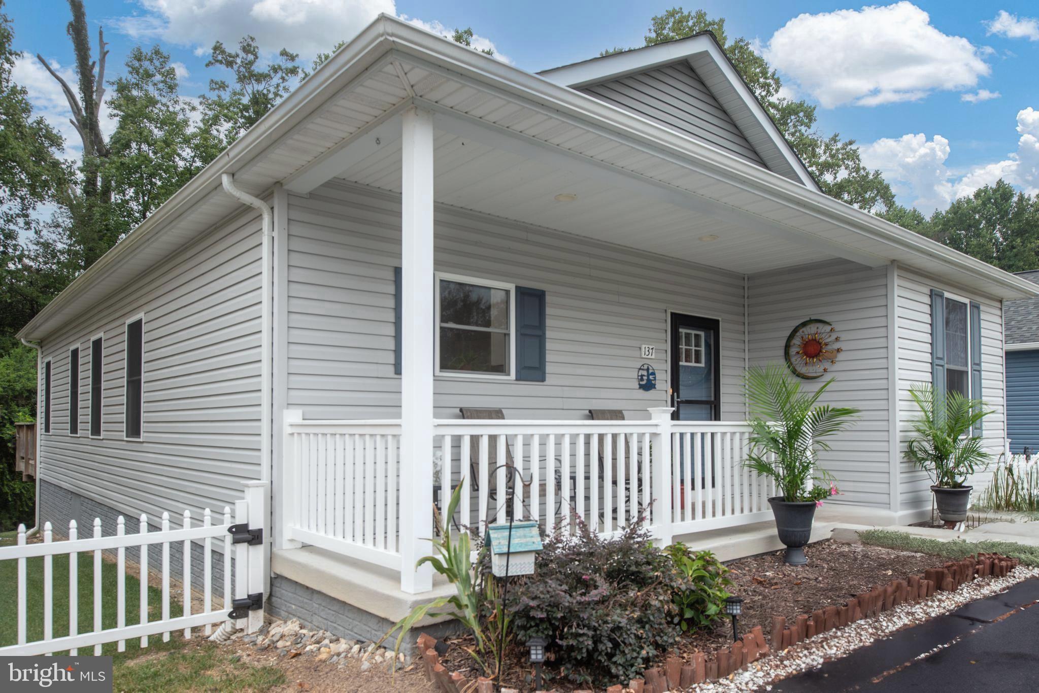 137 12th Street Colonial Beach, VA 22443 - Photo 2 of 66 a front view of a house having porch