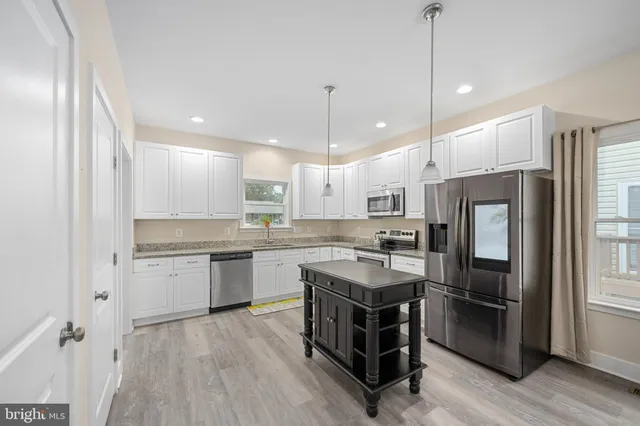 a bedroom with furniture and a wooden floor