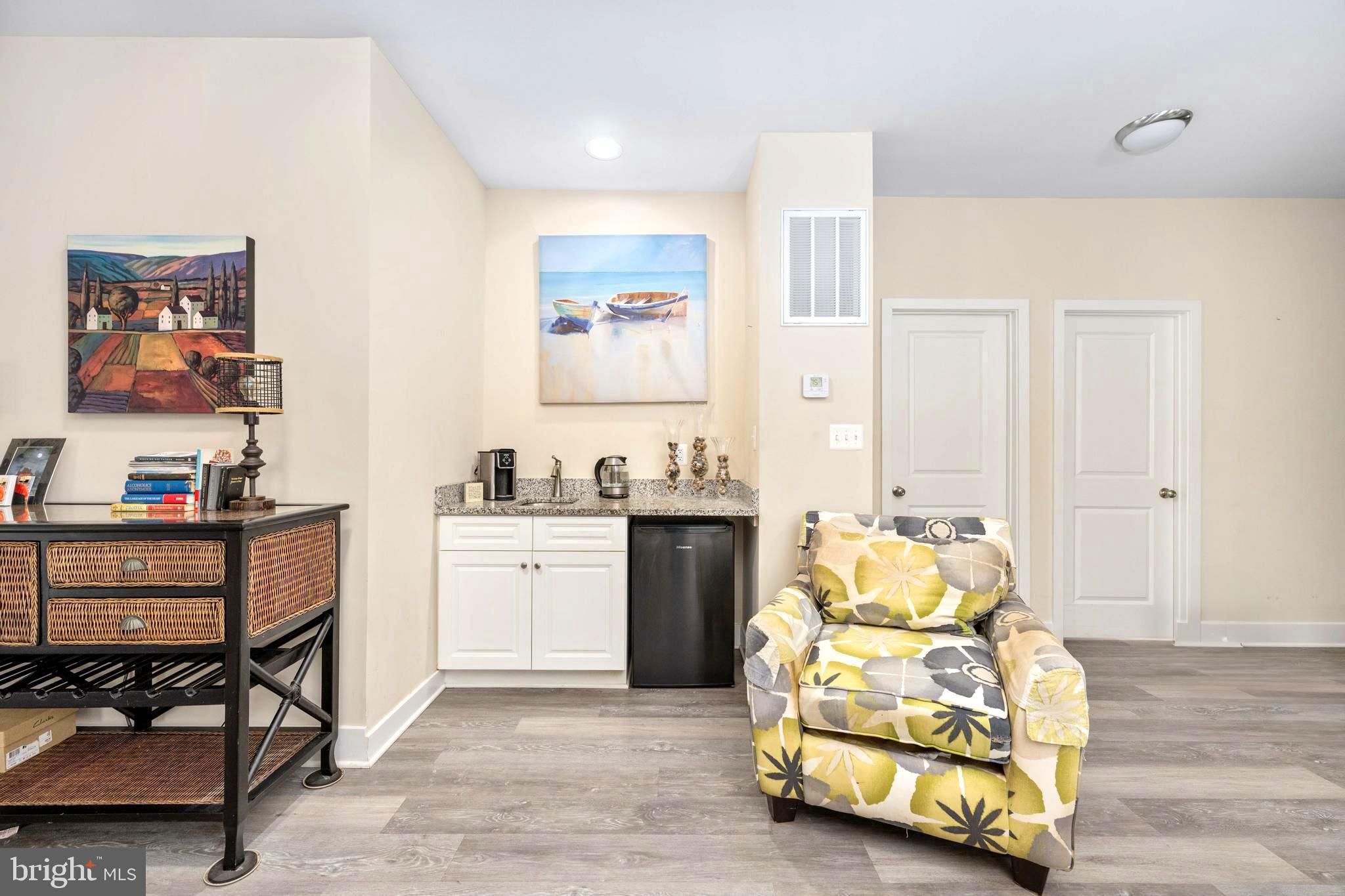 137 12th Street Colonial Beach, VA 22443 - Photo 34 of 66 a bedroom with furniture and a wooden floor