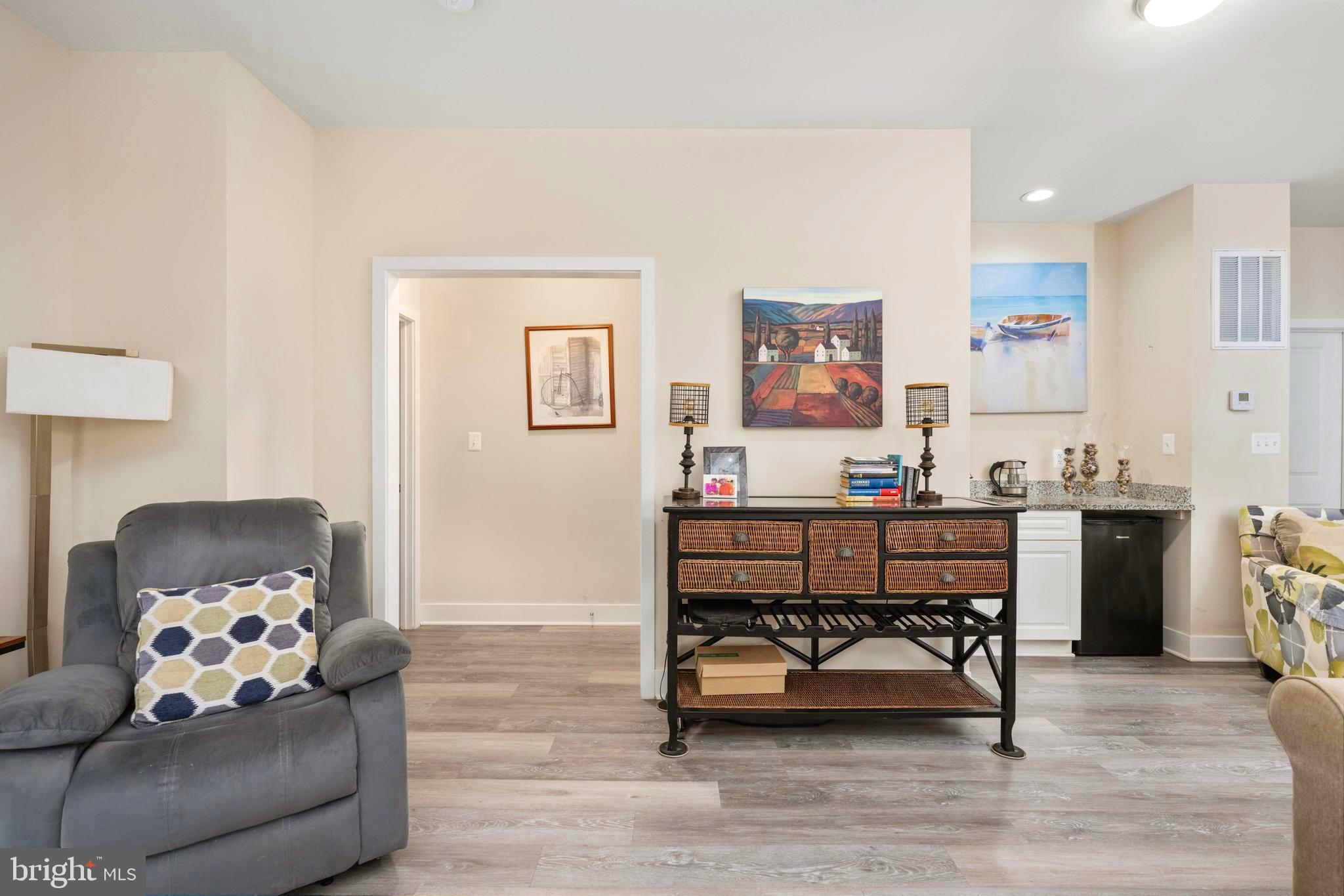 137 12th Street Colonial Beach, VA 22443 - Photo 35 of 66 a living room with furniture and a wooden floor