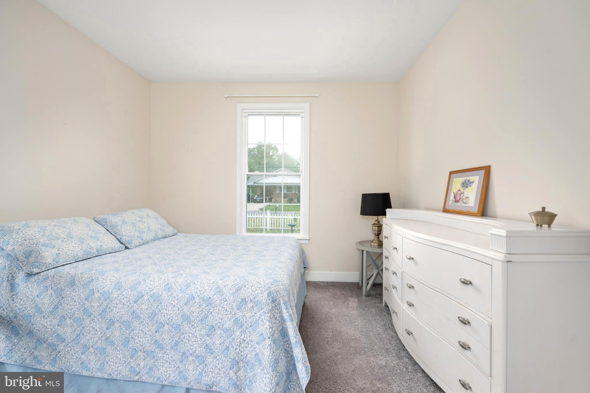 137 12th Street Colonial Beach, VA 22443 - Photo 38 of 66 a bedroom with a bed and a window