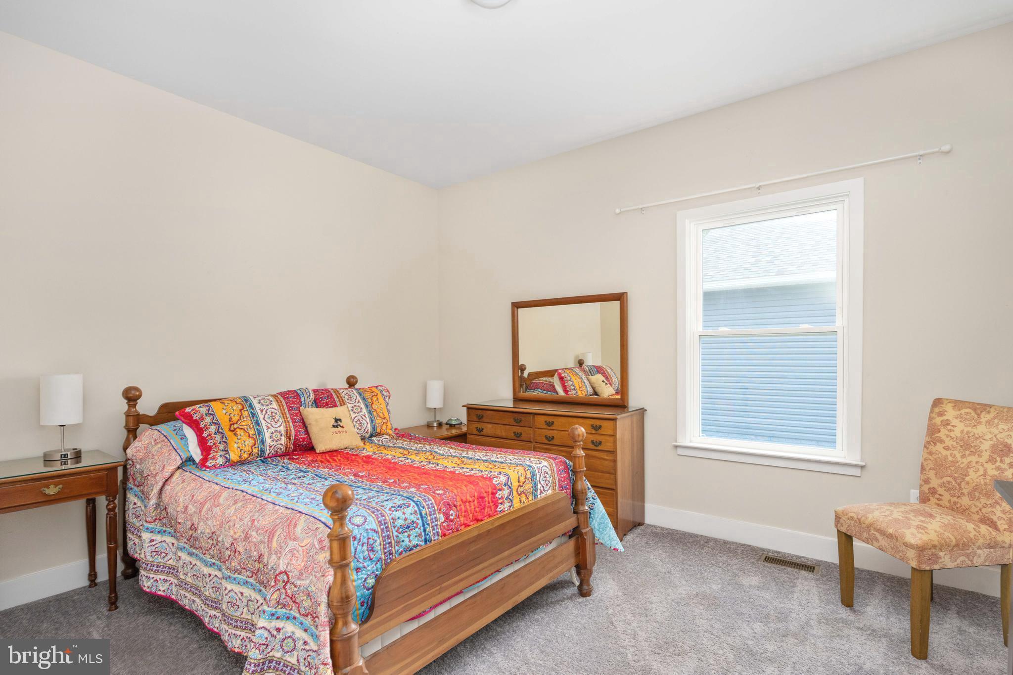 137 12th Street Colonial Beach, VA 22443 - Photo 39 of 66 a bedroom with a bed and window