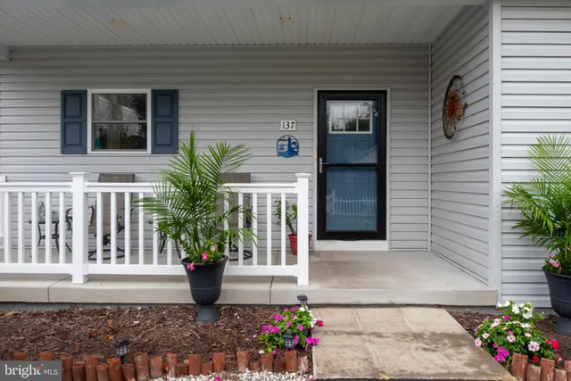 a front view of a house with a porch