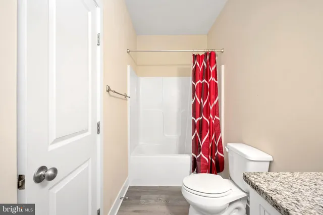 a view of a chair and table in the balcony