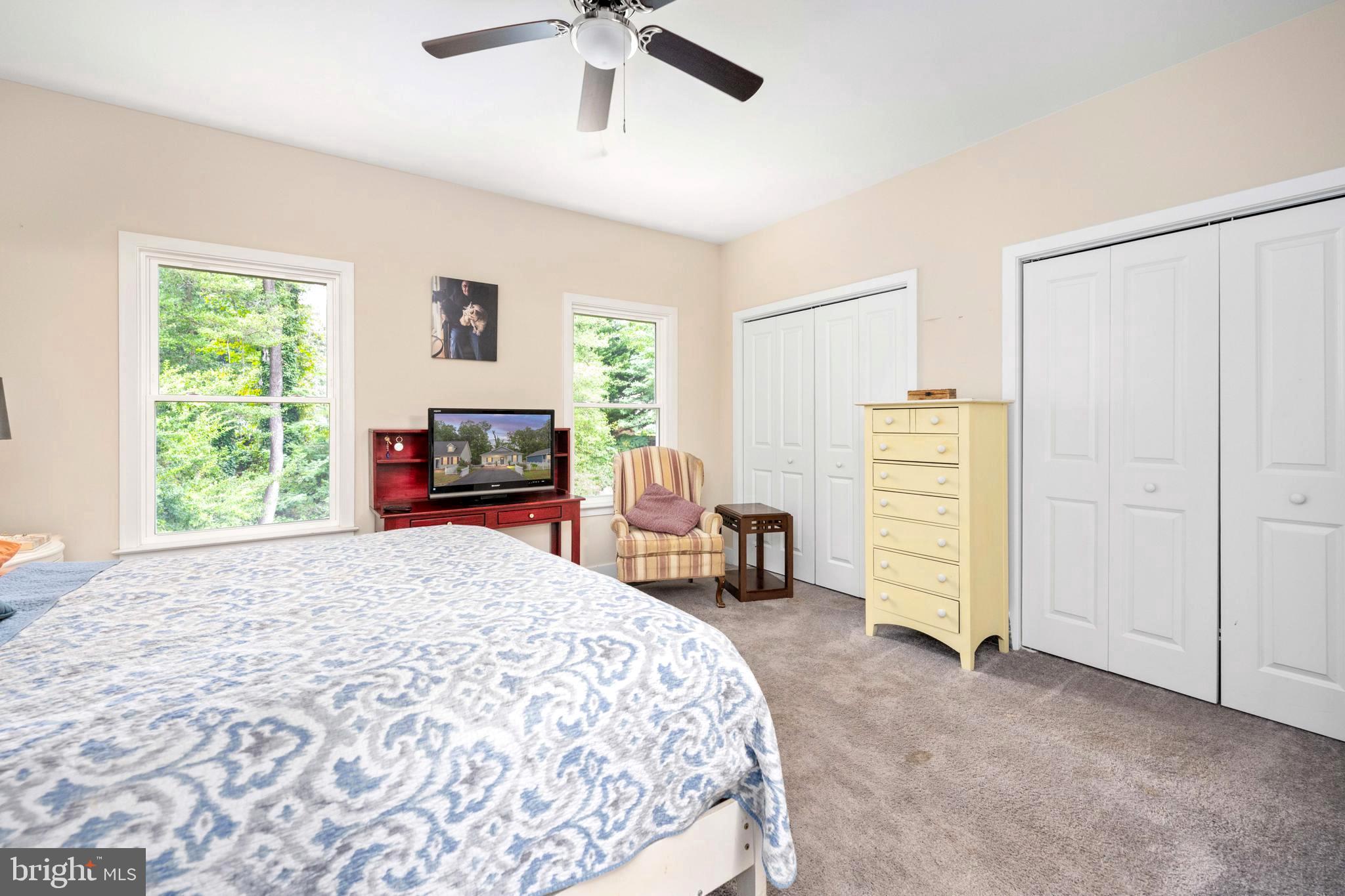 137 12th Street Colonial Beach, VA 22443 - Photo 43 of 66 a bedroom with a bed and a chair