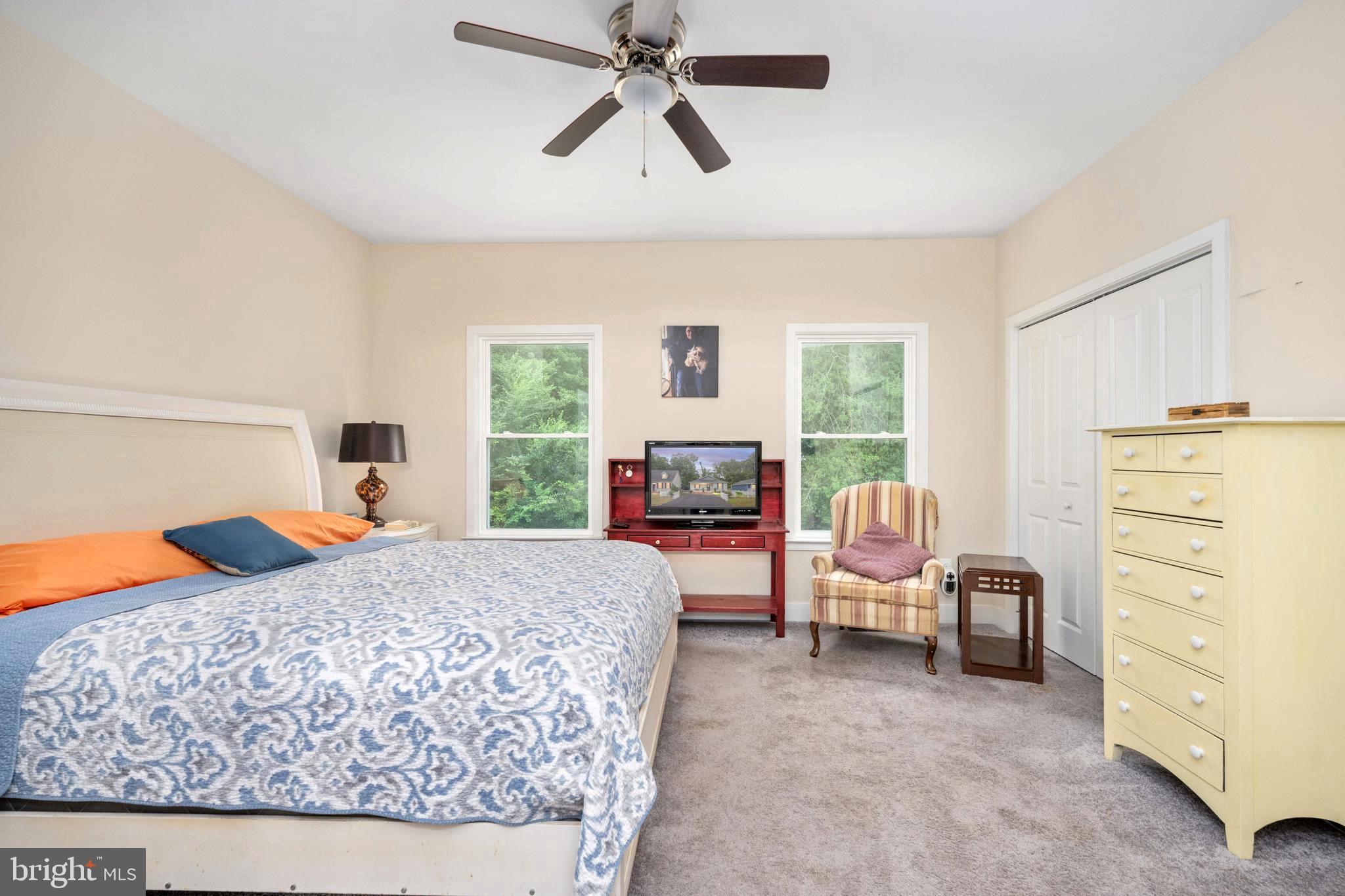 137 12th Street Colonial Beach, VA 22443 - Photo 44 of 66 a bedroom with a bed and furniture