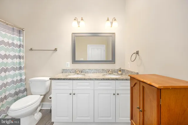 a front view of a building with garden