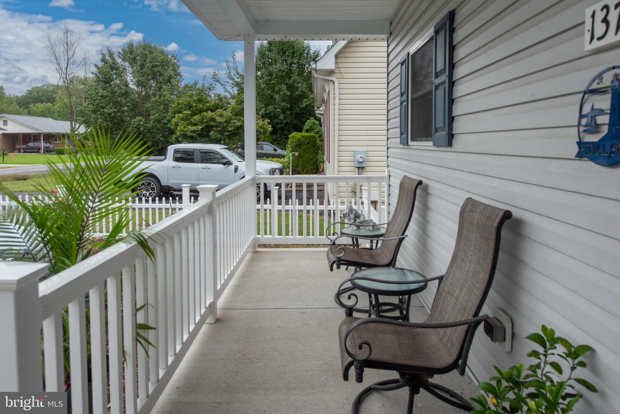 137 12th Street Colonial Beach, VA 22443 - Photo 50 of 66 a view of a chair and table in the balcony