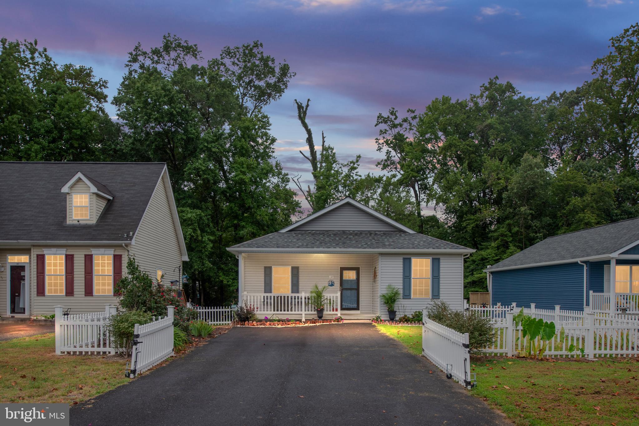137 12th Street Colonial Beach, VA 22443 - Photo 66 of 66 a front view of a house with a yard table and chairs