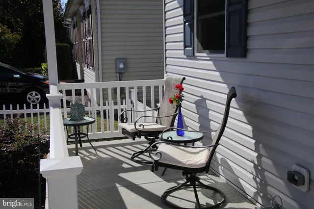 a view of a house with wooden deck