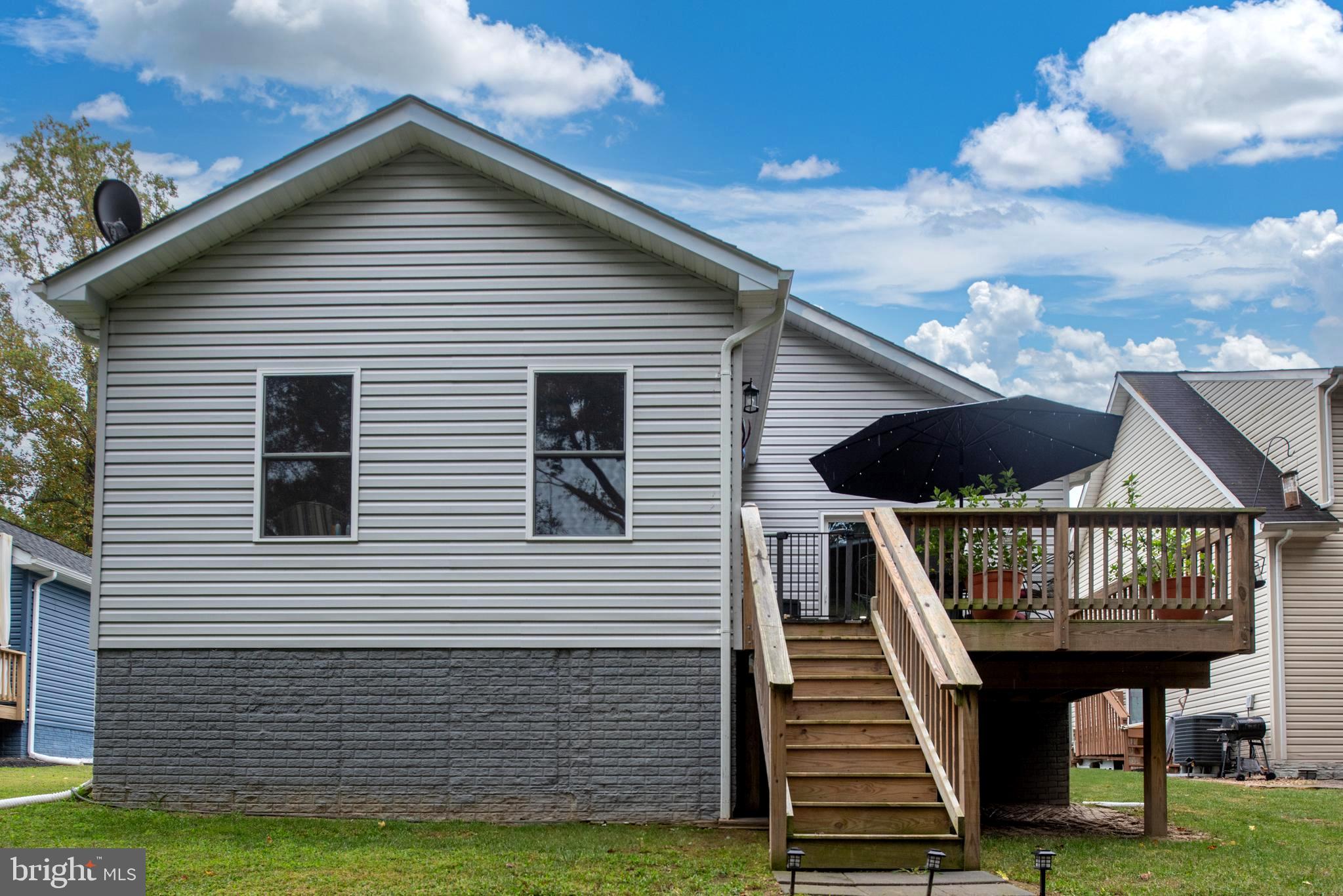 137 12th Street Colonial Beach, VA 22443 - Photo 10 of 66 a view of a house with wooden deck
