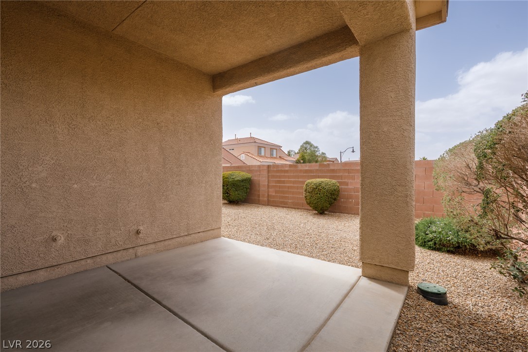 787 Rise Canyon Drive Henderson, NV 89052 - Photo 17 of 22 A spacious covered patio provides a shaded retreat overlooking the low-maintenance gravel yard.