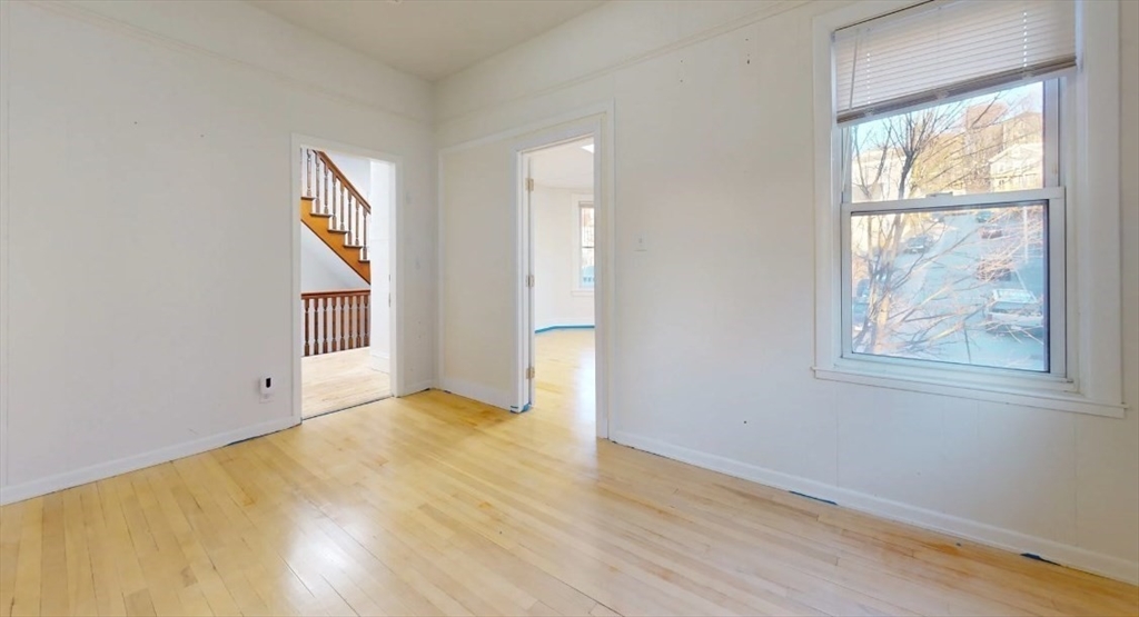 18 Elizabeth Street Worcester, MA 01605 - Photo 11 of 13 an empty room with windows and closet