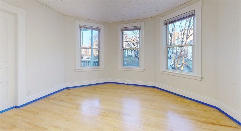 18 Elizabeth Street Worcester, MA 01605 - Photo 5 of 13 an empty room with windows