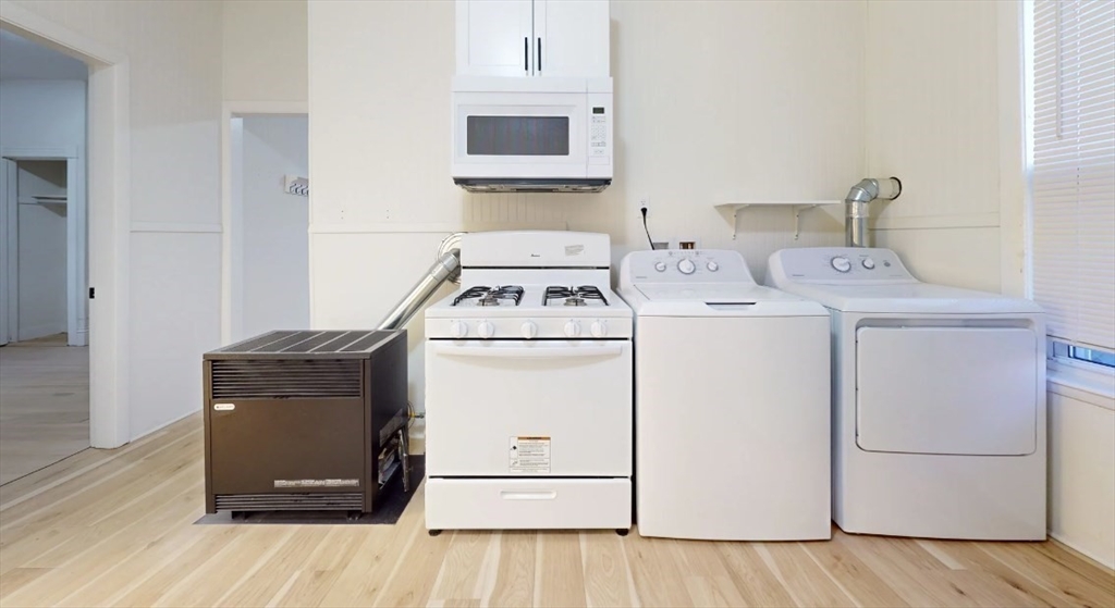 18 Elizabeth Street Worcester, MA 01605 - Photo 10 of 13 a utility room with dryer and washer
