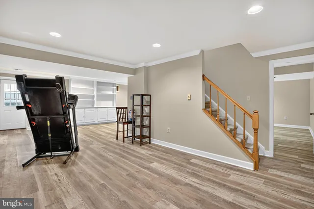 a view of a balcony with floor to ceiling windows and trees